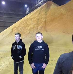 boys by grain pile